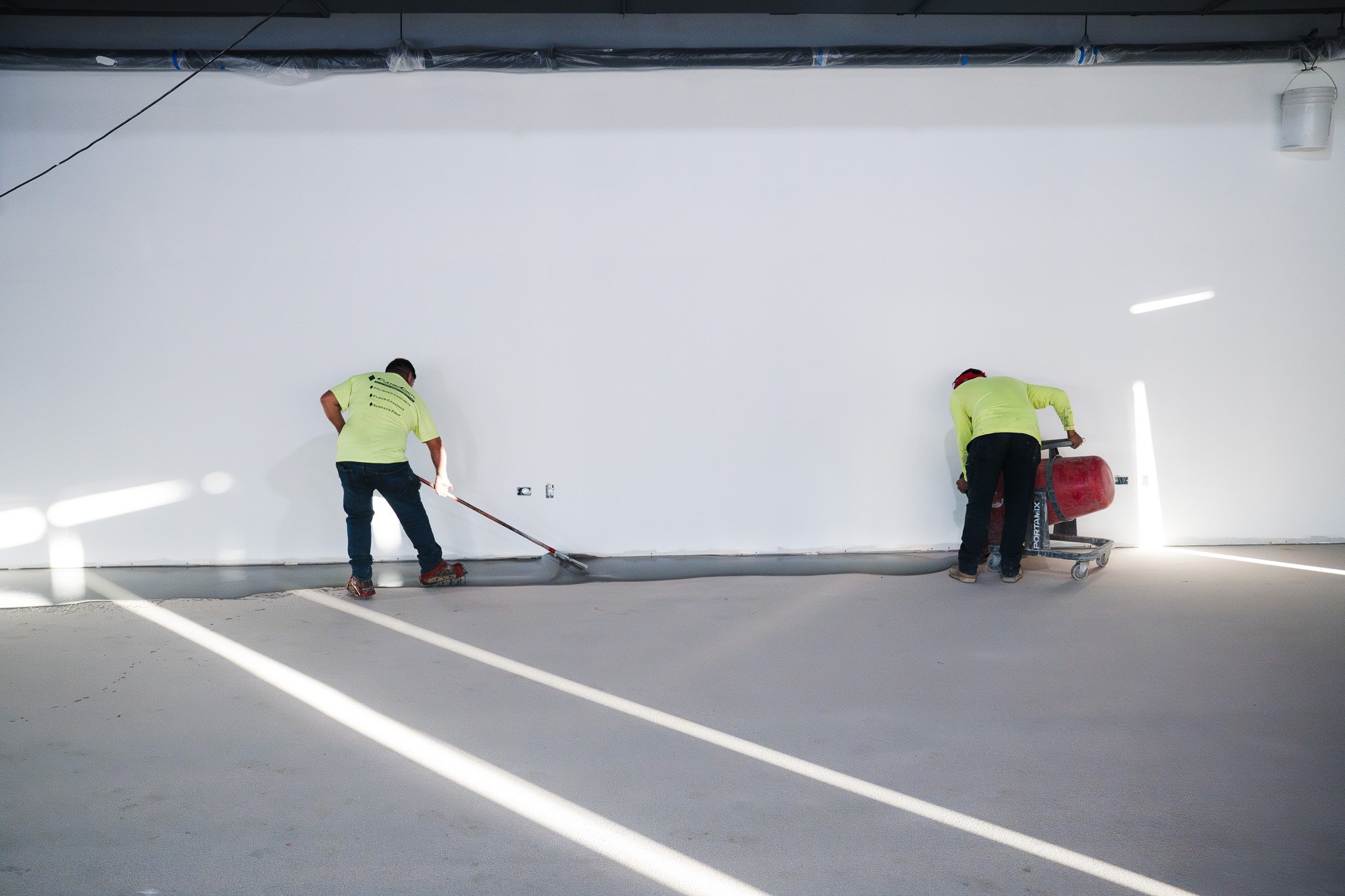 Laying down concrete coating