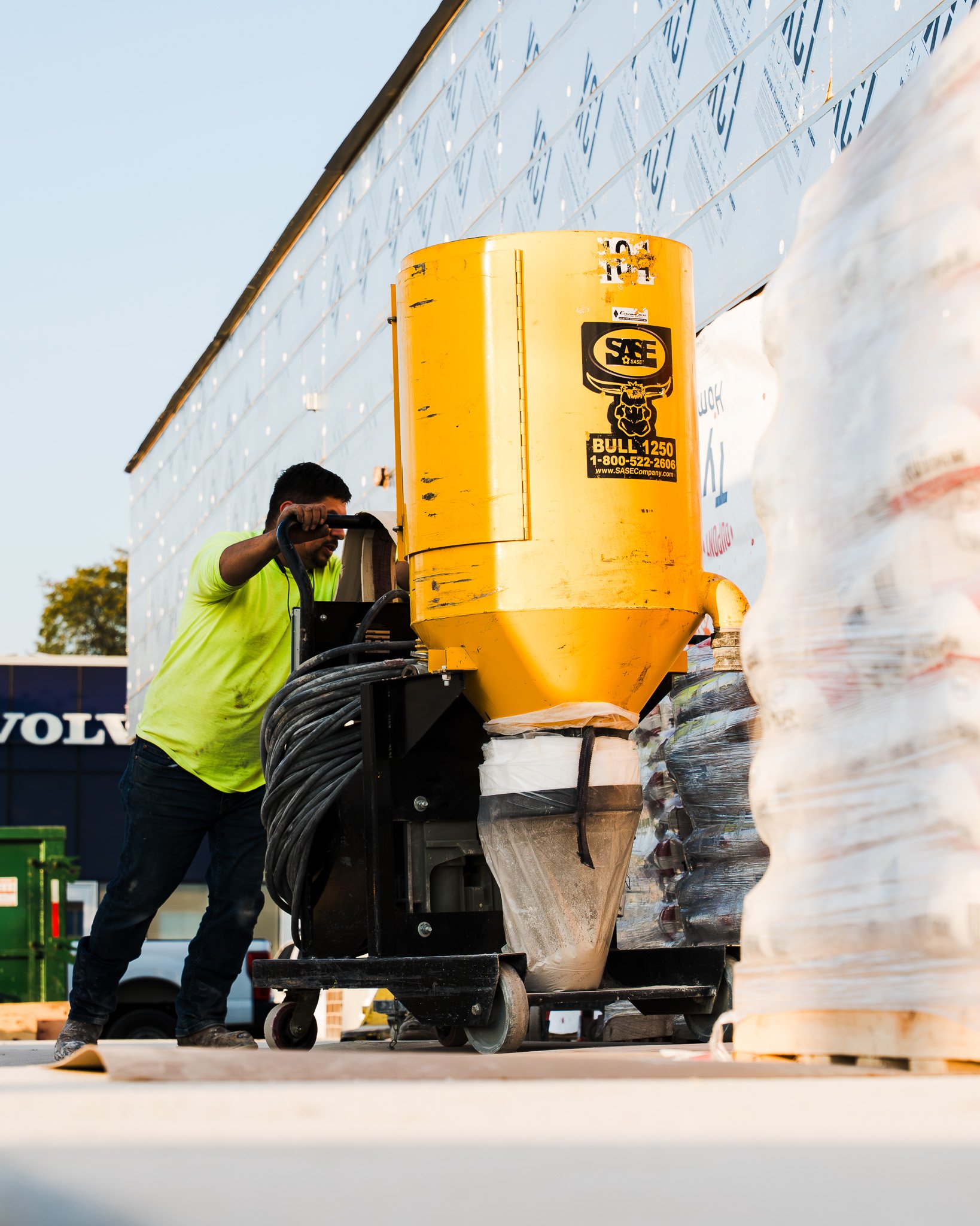 CustomCrete Employee using SASE vacuum