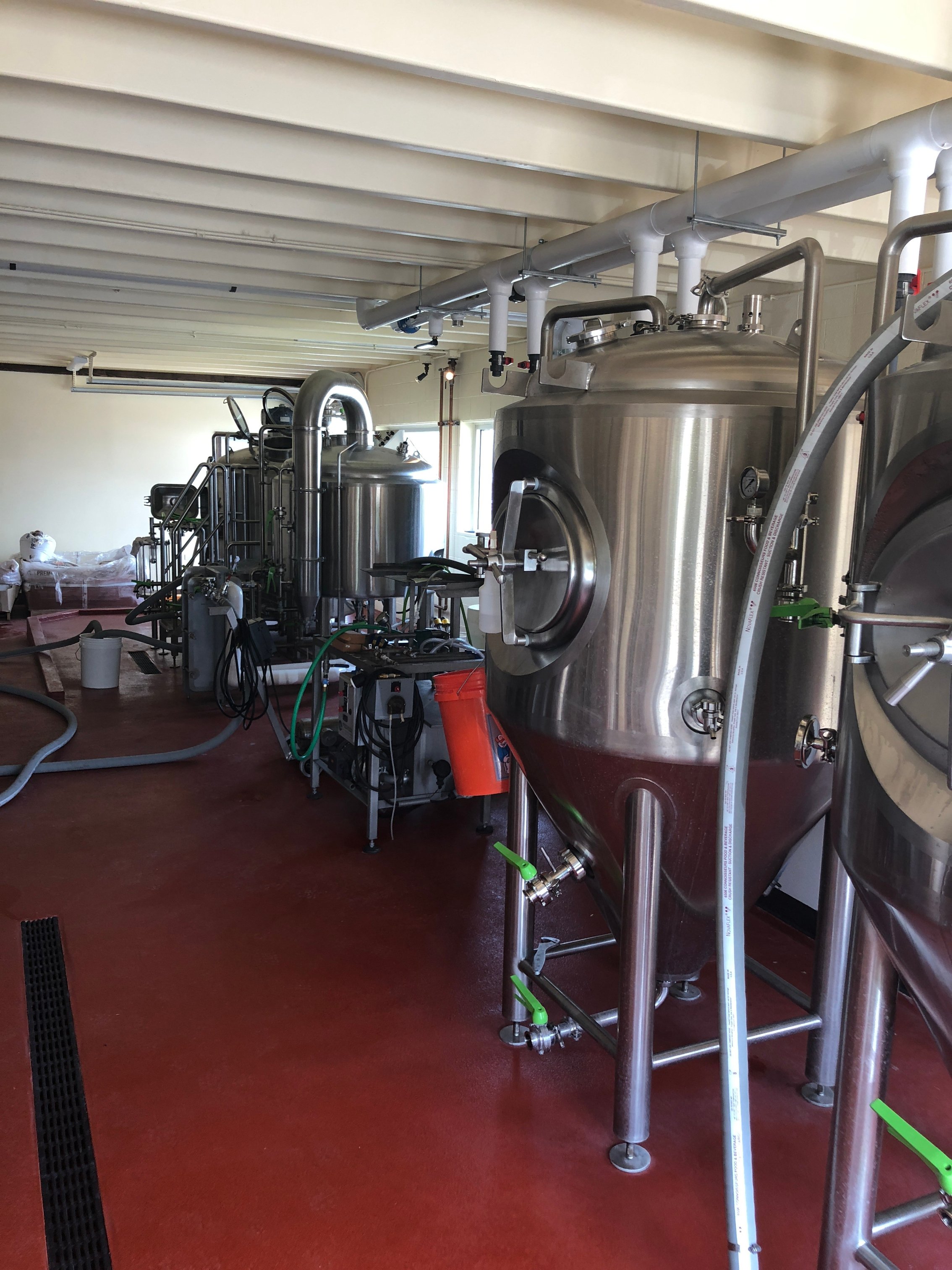 colored Urethane cement flooring in a brewery in Illinois with machinery