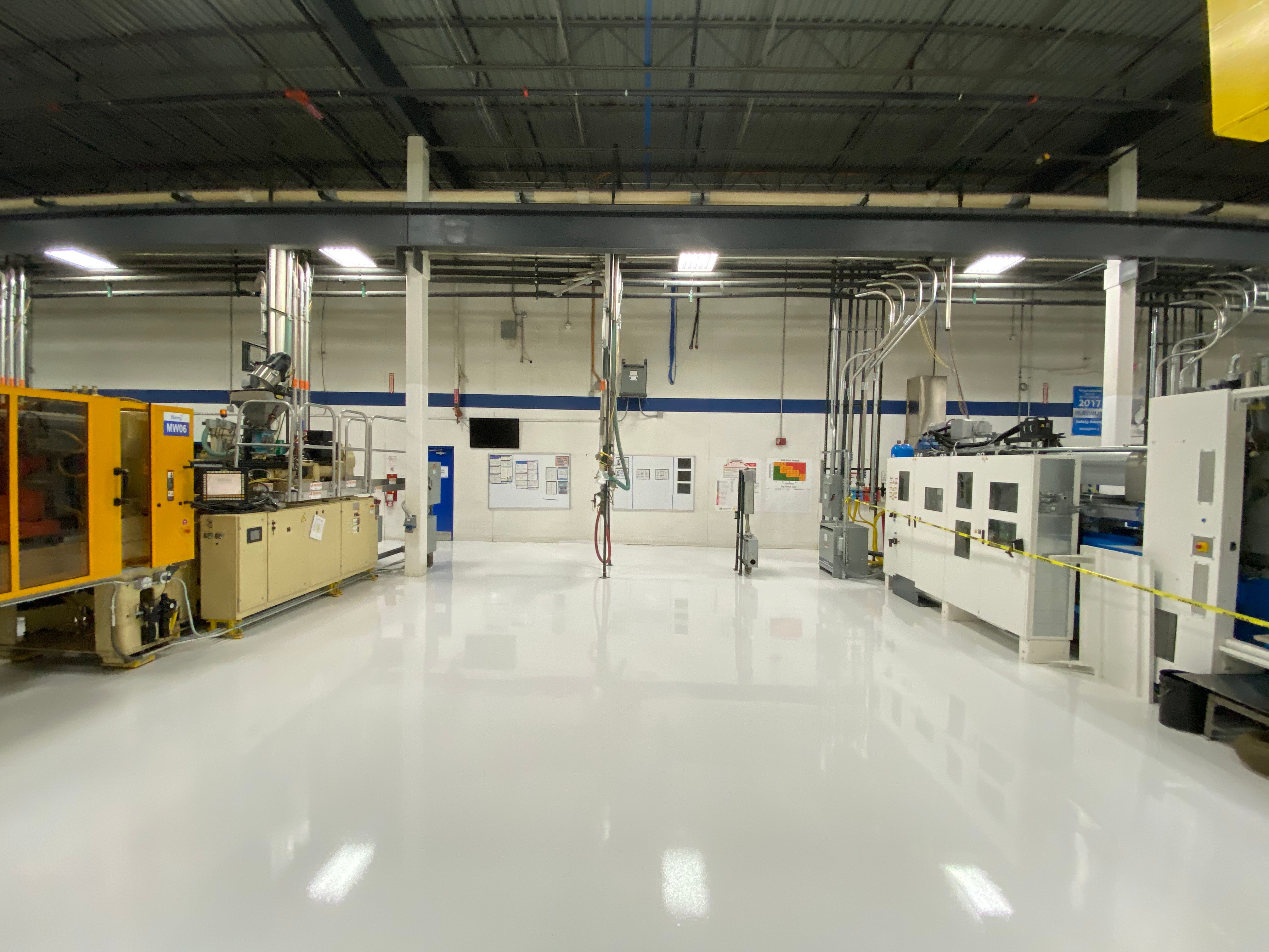 clean white epoxy flooring industrial facility 