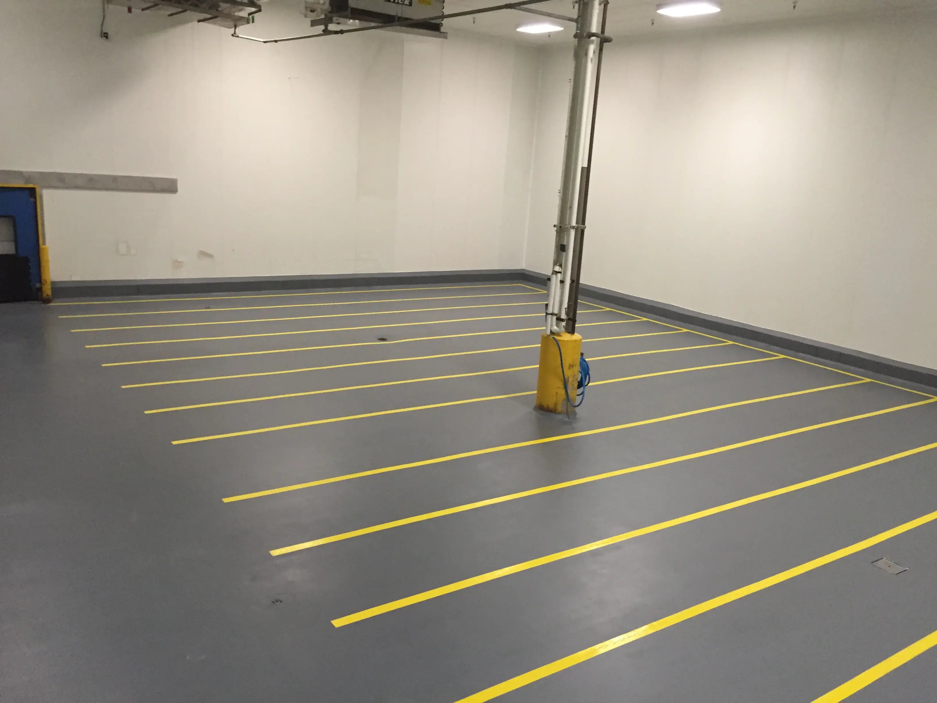 grey Urethane Cement with yellow safety lines 