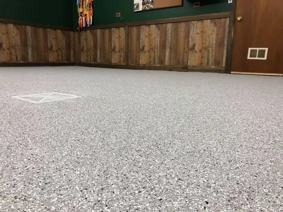 Epoxy floor with grey decorative flake in a Naperville facility