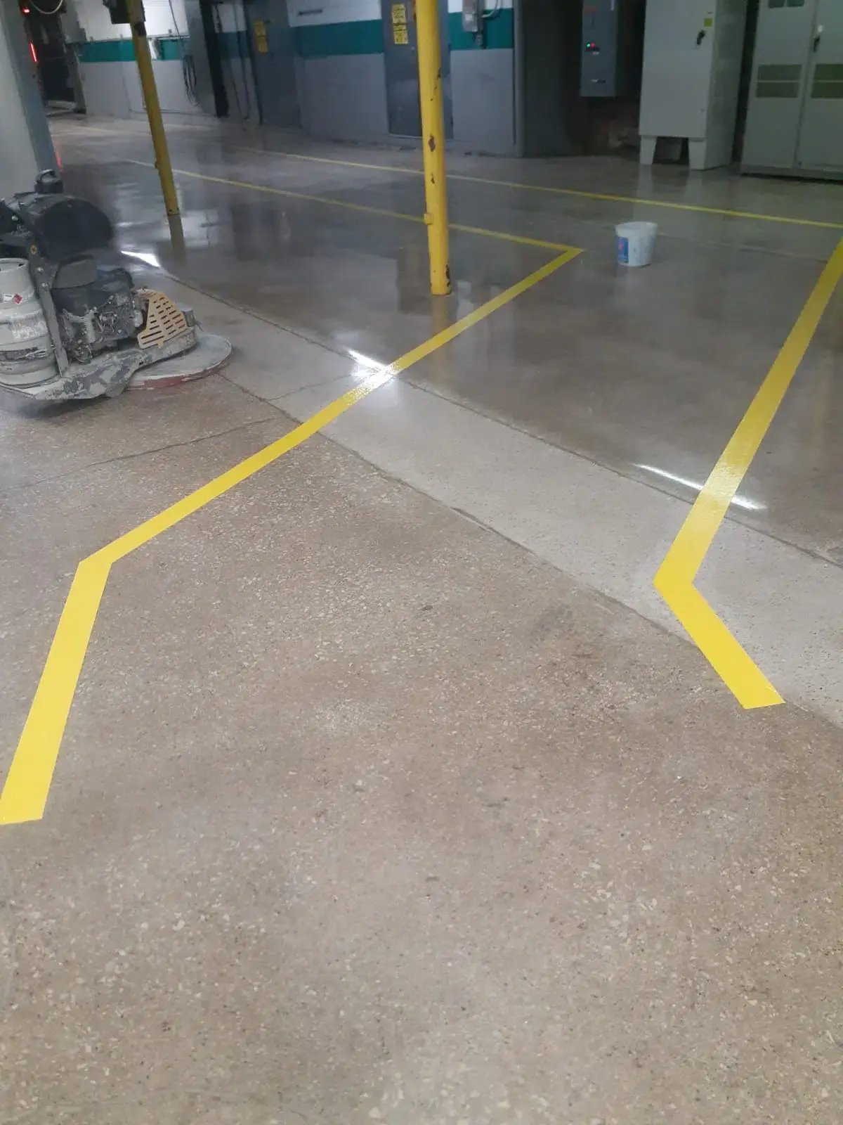 Polished Concrete  in a warehouse with yellow safety lines