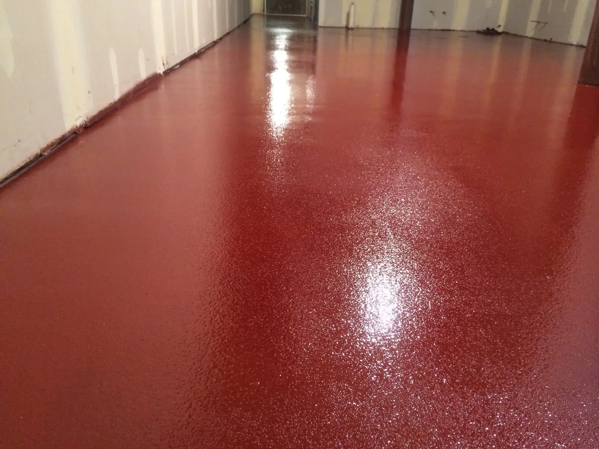 striking red epoxy floor with texture in a Chicago based manufacturing plant