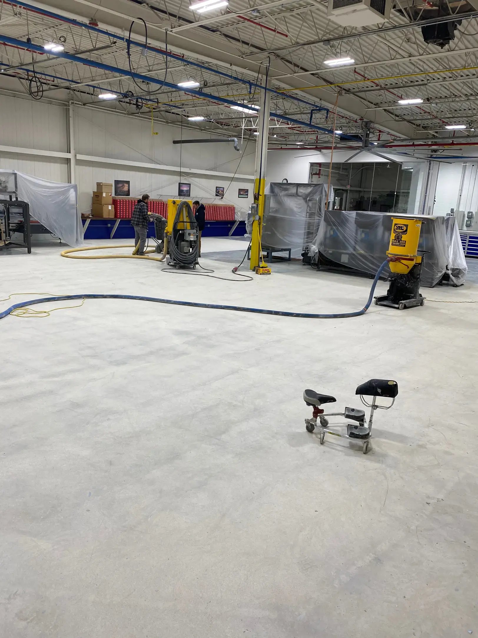 workers grind a floor in a warehouse in Pleasant Prairie Wisconsin