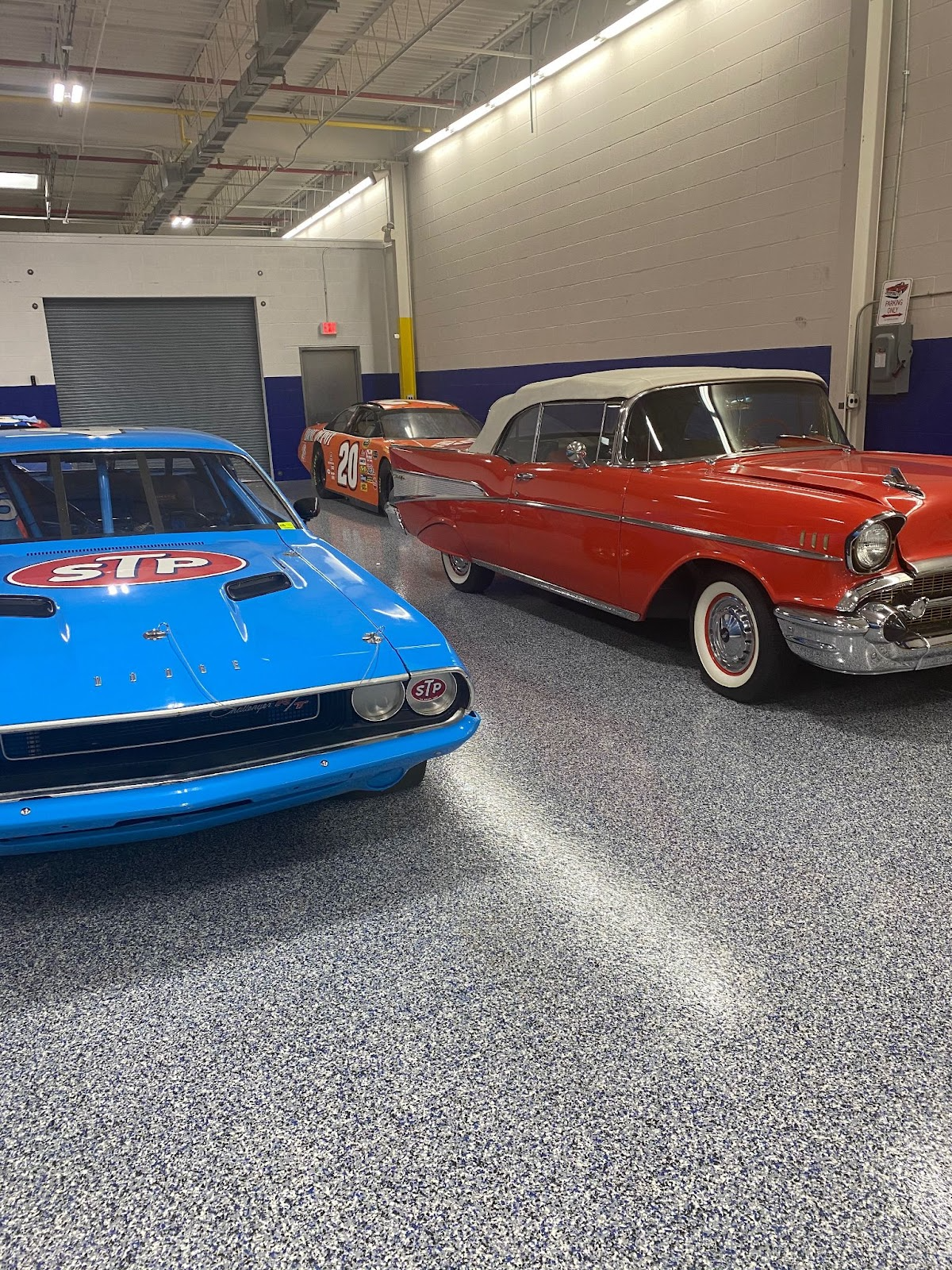 Cars in a garage with flake flooring