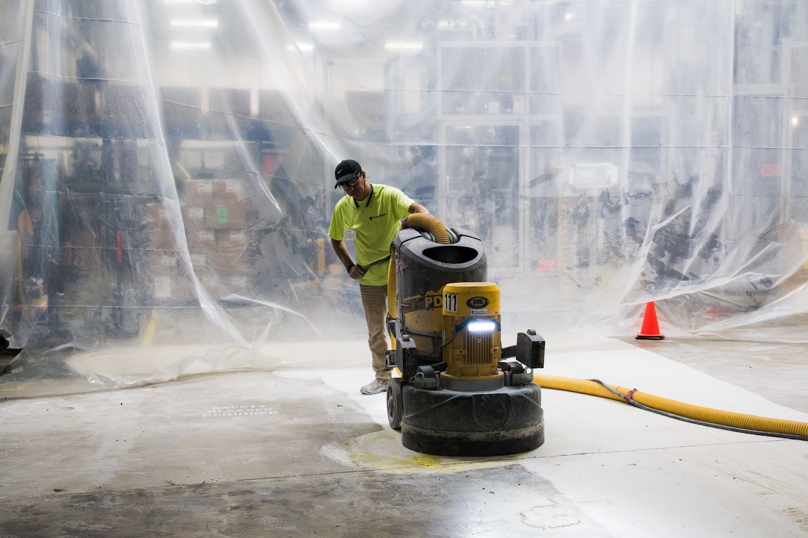 Person with floor grinder